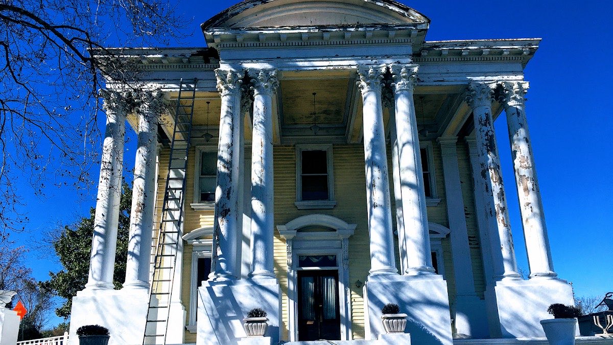 Historic home exterior with columns and detailed trim painting