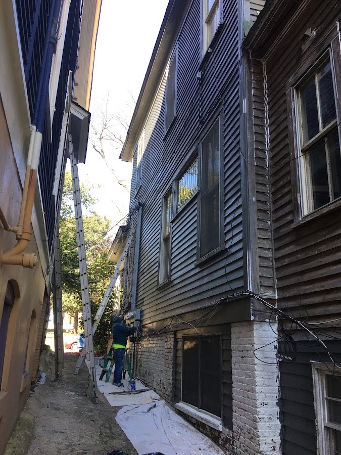 Exterior siding painting on historic building
